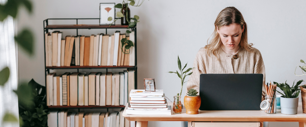 professional website designer working on web page design on her laptop